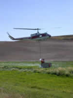 Sun 11 - DNR helicopter filling its bucket.
